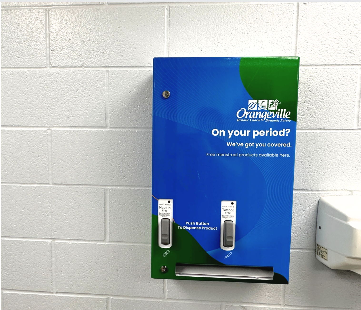 A picture of a menstrual product dispenser